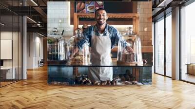 Bakery, happy and portrait of man in cafe ready for serving pastry and baked foods for small business. Restaurant, coffee shop and confident waiter or barista by counter for service, help and welcome Wall mural