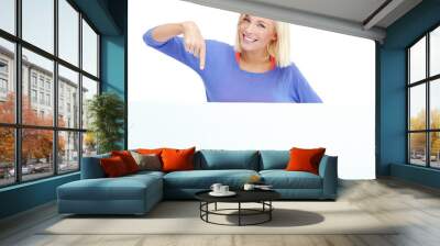 Blank, poster and portrait of woman in studio with pointing, smile or deal promo for giveaway info. Billboard, news announcement and girl with mockup sign, card or offer space on white background Wall mural