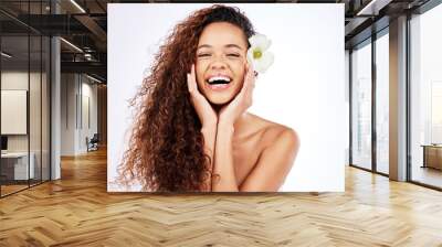 Brazilian girl, portrait and flower with white background for hair care, wellness and organic or sustainable cosmetics for natural treatment. Woman, mock up and studio with healthy frizz and growth. Wall mural