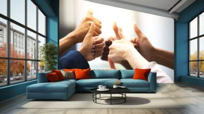 Business people, hands and thumbs up for support, success and team work in office collaboration. Worker, group or circle in like, yes and okay gesture for good job, winning and well done with goals Wall mural