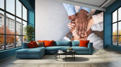 Business people, hands stack and support above for collaboration and inclusion in office for equality. Workplace community, staff and huddle together for solidarity and cooperation with team building Wall mural