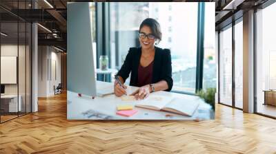 Business woman, computer and happy in office for work, schedule and planning with notebook. Project manager, technology and smile in workplace for kpi, administration and company goals with research Wall mural