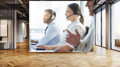 Call center, woman and smile with headphone, conversation and communication in workplace. Group, technology and telemarketing agent or team in office for consulting, customer service and support Wall mural