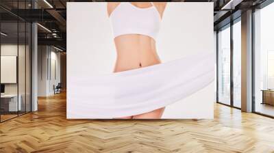 Closeup, body and woman with underwear, fabric and fitness on white studio background. Person, model and girl with exercise, health or stomach with balance, fiber or tummy with workout or training Wall mural