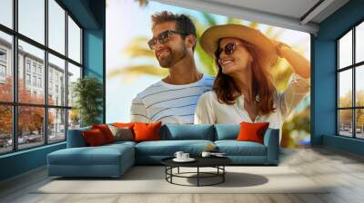 Couple, people and happy on holiday in outdoor with lens flare in summer for fun and relax in Spain. Relationship, love and smile with support or on vacation, trip and travel together as soulmate Wall mural