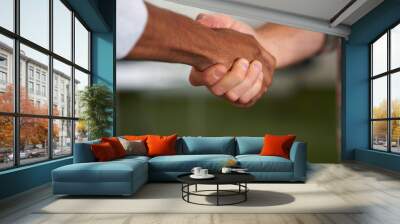 Creative people, handshake and meeting for thank you, hiring or deal together for teamwork at office. Employees, shaking hands and partnership, agreement or recruiting for job in startup at workplace Wall mural