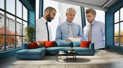 Discussion, meeting and tablet with business people in office together for conversation or planning. Collaboration, management and research with employee men in corporate workplace for feedback Wall mural