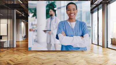 Doctor, black woman and arms crossed with smile in portrait at hospital for medical career. Person, surgeon and healthcare professional in corridor at clinic for wellness, services and job in Mexico Wall mural