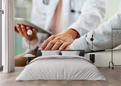 Doctor, patient and holding hands with tablet in consultation with support, empathy and announcement. Medic, person and touchscreen with comfort, diagnosis or app with healthcare service at hospital Wall mural