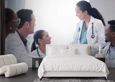 Doctors, men and women in meeting, healthcare and support with team building, conversation and wellness. Staff, medical and professional with discussion, cooperation and communication with medicare Wall mural