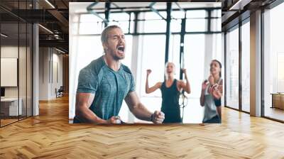 exercise, people and scream to celebrate success in workout class, fitness and training goals. Sports, man and happiness for power challenge, winner or performance achievement at health club or gym Wall mural