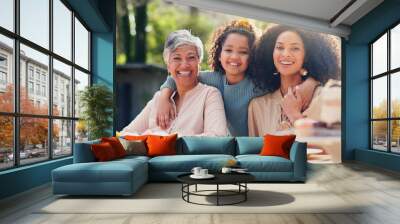 Family, hug and face at birthday party on table outdoor with mother, child and grandma with smile. Summer, event and celebration with love, support and girl in garden with generation of women or moth Wall mural