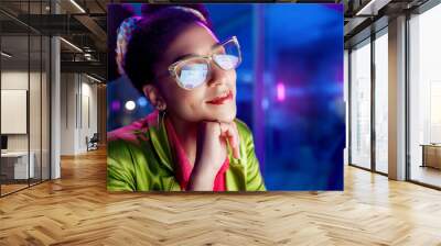 Fashion, typing and woman in office for creative job in company, smile and happiness with glasses. Female person, happy and technology for business as designer, entrepreneur and workplace for girl Wall mural