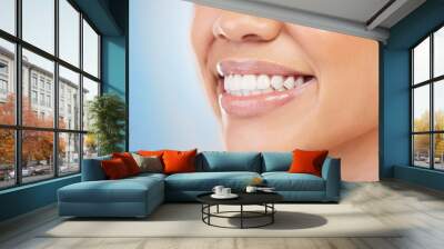 Female person, smile and zoom for treatment, filling and polish for cosmetic in blue background. Teeth, closeup and dental with hygiene, mouth and oral care for health, wellness and clean in studio Wall mural