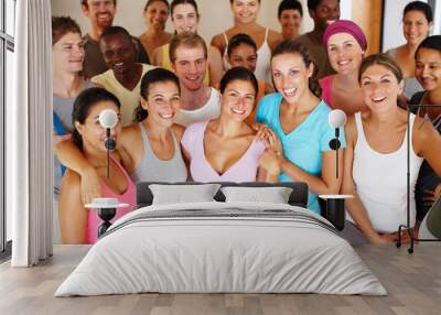 Fitness, group and portrait of people in gym for exercise class, support and solidarity in wellness. Diversity, friends and smile with confidence in health club for workout, pride or happy in morning Wall mural