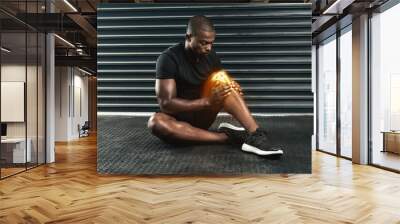 Fitness, injury and black man with knee pain on floor for sports accident, strain or muscle fatigue. Leg, overlay and athlete with exercise emergency for swollen tendon, inflammation or medical issue Wall mural