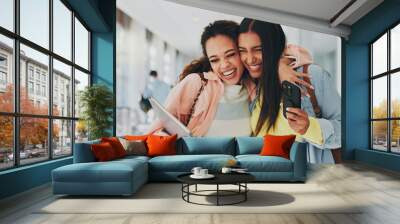 Friends, happy and excited in university for hug, storytelling and good news on phone. Students, support and mobile in hallway for admission, unexpected notification or acceptance to higher education Wall mural