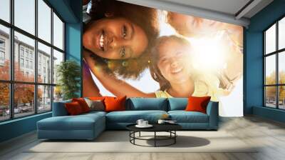 Friends, low angle and portrait of children on camp for friendship, playing and fun together. Diversity, youth and girls huddle in circle for childhood, game and hug for school, recess and playground Wall mural