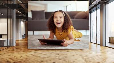 Girl, child and portrait with tablet on floor for elearning, educational games or watching cartoon in home. Kid, face and happy with digital tech for online browsing, streaming app or relax in lounge Wall mural