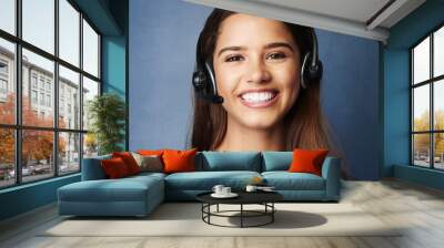 Girl, smile and studio portrait for call center work, telemarketing career and virtual assistant for outbound sales company. Woman, blue background and faq for contact us, communication and support. Wall mural