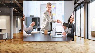 Handshake, meeting and happy business people in office for teamwork, collaboration and partnership. Corporate, professional and men and women shaking hands for agreement, b2b deal and presentation Wall mural