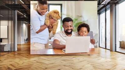 Happy, black family and laptop to relax with dogs at house in kitchen browsing internet for online shopping pet care. Parents, child and animal for streaming website funny puppy video on vacation Wall mural