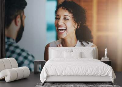 Happy, couple and sharing good news with celebration for promotion or announcement at home together. Smile, woman and man with job success, wow and career milestone with communication and discussion Wall mural