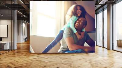 Happy, dad and girl with hug on sofa in living room for support, love and gratitude on fathers day. Playful, black family and man with little kid at home for bonding, weekend and care in childhood Wall mural