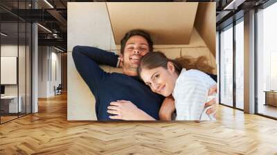 Happy couple, portrait and relax with box on floor for moving in new home, property or apartment above. Top view of man and woman with smile in relaxation for house, investment or break with boxes Wall mural