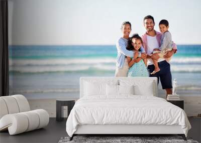 Happy family, ocean and smile in portrait for holiday or travel, solidarity in Mexico with children. Mom, dad and kids by beach for vacation with sea adventure, freedom in nature with mockup space Wall mural