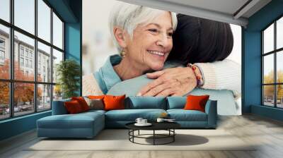 Happy senior woman, hug and elderly care for thank you, gratitude or support for caregiver at home. Mature female person or patient embracing medical or healthcare worker in trust, happiness or house Wall mural