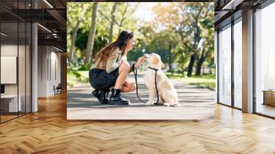 Happy woman, dog and park with friendship, bonding and wellness, travel and journey on island. Female person, cheerful and pet care for walk, fresh air in outdoor on path in nature for training Wall mural