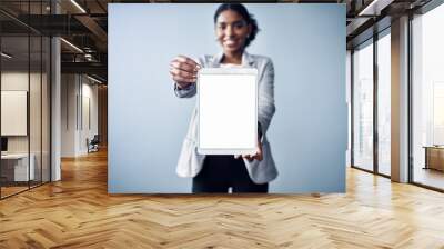 Happy woman, portrait and tablet with mockup screen for advertising or marketing on a gray studio background. Female person or employee with technology, display or app for review or advertisement Wall mural