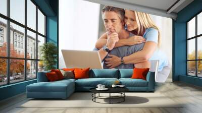 Home, mature couple and thinking with laptop for insurance cover, online research and information. House, woman and man with planning for investment, financial review and wife for support with hug Wall mural