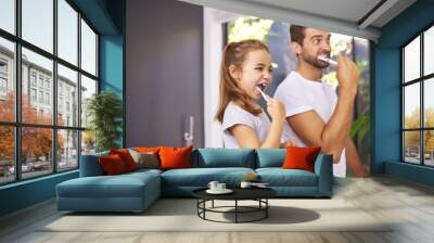 House, brushing teeth and father with girl, cleaning mouth and morning routine with grooming. Family, dad and daughter with fresh breath, dental hygiene and oral care with dental wellness and playful Wall mural