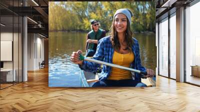 Lake, canoe and couple with nature, love and happiness with romance, relationship or bonding together. Water, river or man with woman, environment or getaway trip with weekend break, holiday or smile Wall mural