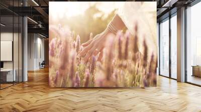 Lavender flower, walking and hand of woman in field for calm, peace, aromatherapy in nature. Plants, outdoor and bride with wedding ring for marriage, natural fragrance or spring blossom in Spain Wall mural