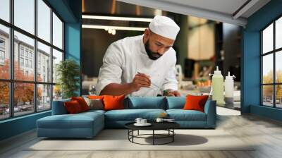 Man, chef and serious with food in kitchen at restaurant for fine dining, meal and creativity. Male employee, professional and cooker with pride for culinarily, hospitality and catering service Wall mural