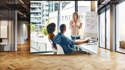 Meeting, whiteboard and workshop with business woman speaking to staff in boardroom of office. Coaching, teaching and training with employee talking to team in workplace for development or growth Wall mural