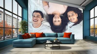 Mom, dad and kid in portrait on bed with smile, love and relax in morning together from above. Mother, father and girl child bonding in bedroom with happy family, fun and care on weekend in home Wall mural