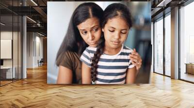 Mom, girl child and sad with comfort for mistake in house, depression or fear in apartment. Mother, daughter and calm empathy in home for childhood fail, together with support for problem or kindness Wall mural