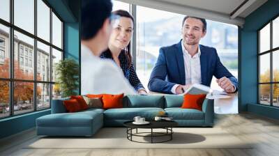 People, tablet and meeting with paperwork, office and explaining to lobbyist, collaboration or planning. Business, talking and employees with documents, woman and man in boardroom or idea for project Wall mural