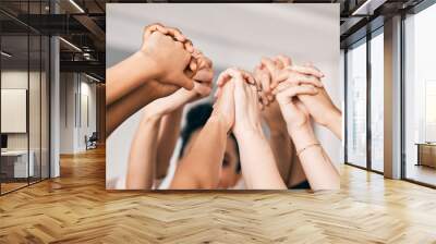 People, unity or holding hands with team for collaboration, synergy or motivation together at office. Closeup, group or community touching for mission, trust or cooperation in solidarity at workplace Wall mural