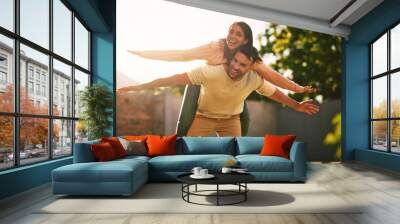 Piggy back, happy and portrait of couple in backyard for bonding, playful relationship and relax outdoors. Dating, morning and man and woman with smile, embrace and laughing in nature for fresh air Wall mural