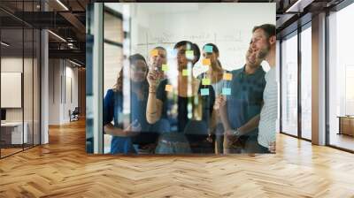 planning is the first step. cropped shot of a group of young designers planning on a glass board. Wall mural