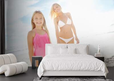 Portrait, mother and daughter holding hands on beach with smile, holiday adventure and bonding together. Happy, mom and child on ocean vacation with support, sunshine and blue sky on walk in nature. Wall mural