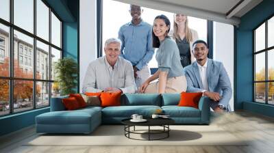 Portrait, smile and group of business people with collaboration for coworking and project meeting in office. Happy teamwork or support and corporate staff by desk for discussion and planning strategy Wall mural