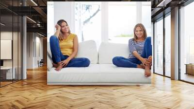 Portrait, twins and women with smile on sofa for family connection, bonding or love on weekend. Relax, happy sisters and adult sibling on couch in living room of home for sisterhood or relationship Wall mural