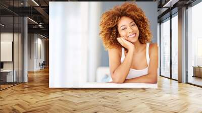 Portrait, woman and happy in home for relax, comfort and weekend chill on sofa. Female person, smile and stress free at living room space for calm, peace and wellness on Sunday afternoon in Brazil Wall mural