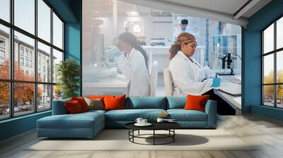 Scientist, woman and notebook with writing in lab for medical research, sample test and virus study. Science, teamwork and checklist for medicine treatment or vaccine experiment at pharma company Wall mural